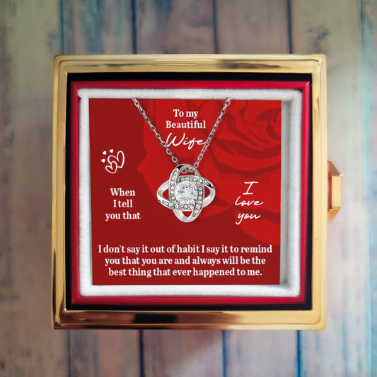 Preserved Rose and Love Knot Necklace in a Rotating Box